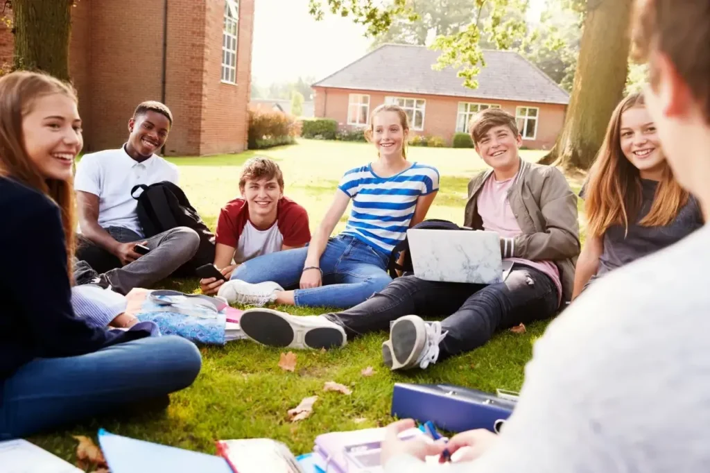 imgi 183 teenage students sitting outdoors and working on p 2024 10 19 05 36 57 utc 1 1