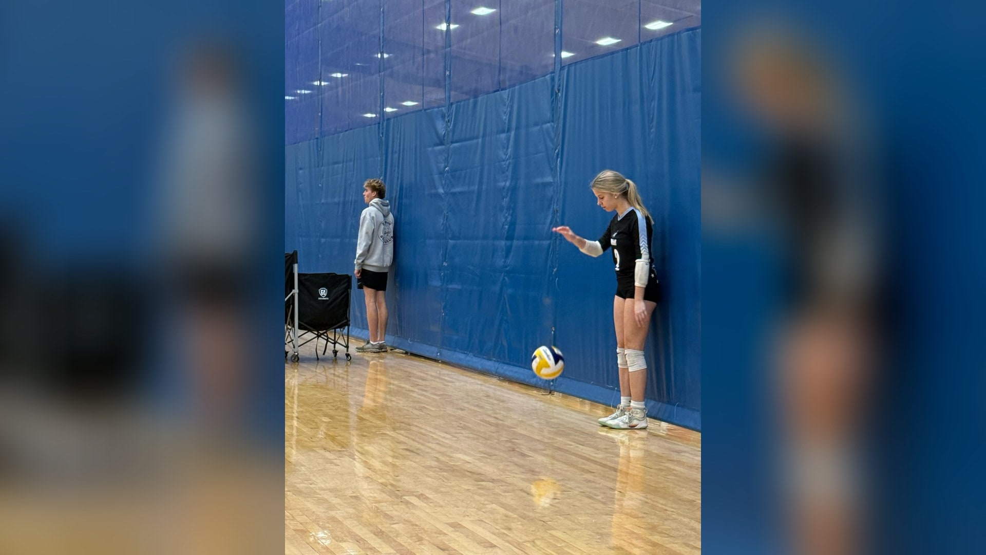 Christopher Parsons watching his daughter Emily play travel volleyball — the season of lasts