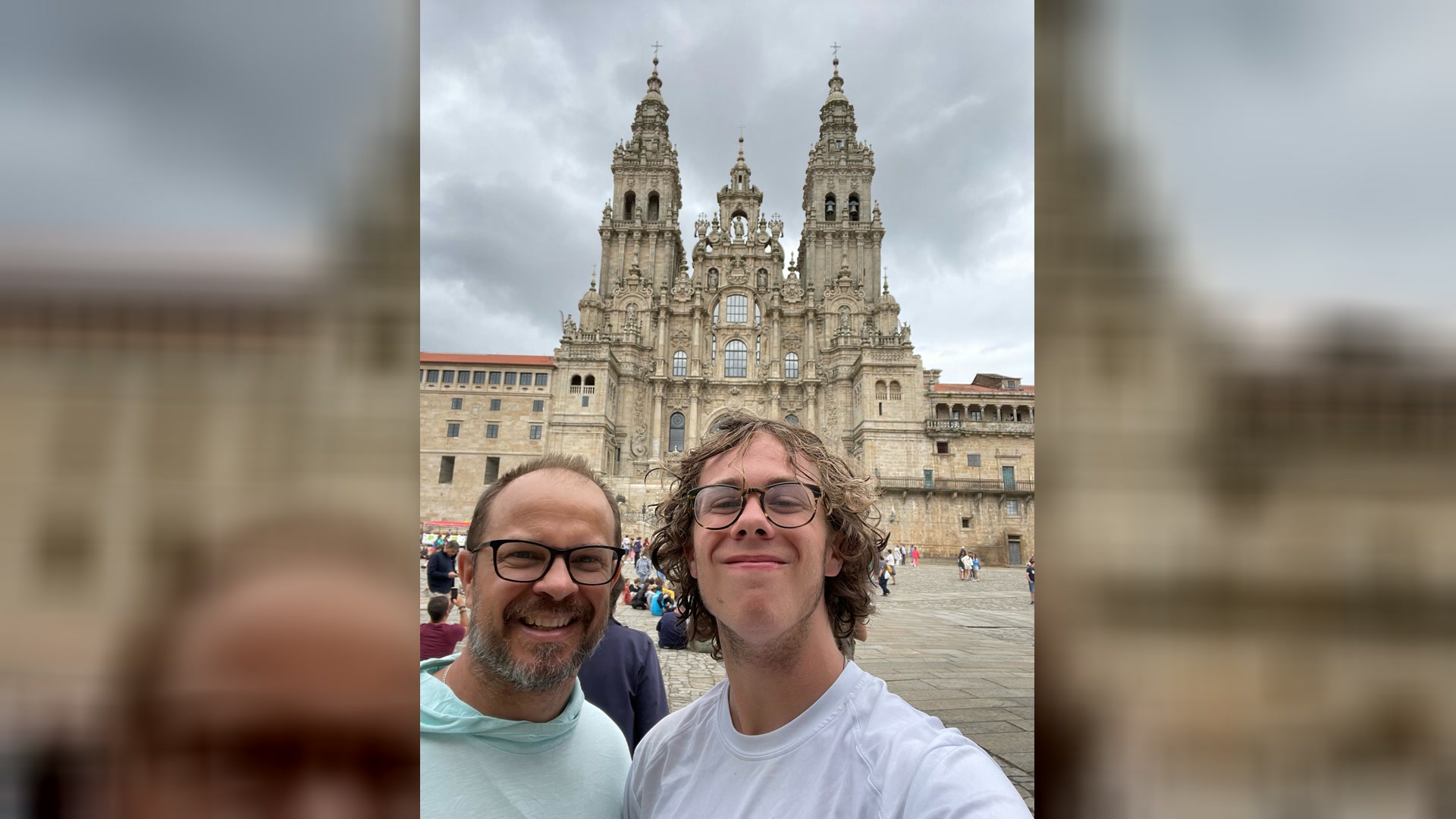 Christopher Parsons and his son in front of the cathedral at Santiago de Compostela — the end of the Camino